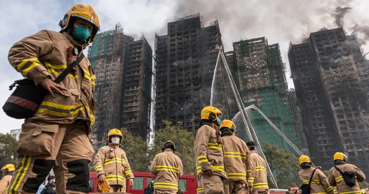Hong Kong leader apologizes for deadly fire that tested Beijing’s grip on city