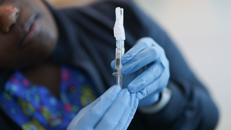 Covid vaccines: FDA approves updated shots for limited groups as US cases continue to rise