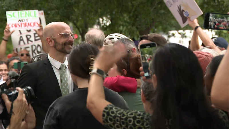 Video shows crowds cheering as CDC officials who resigned walk out of building