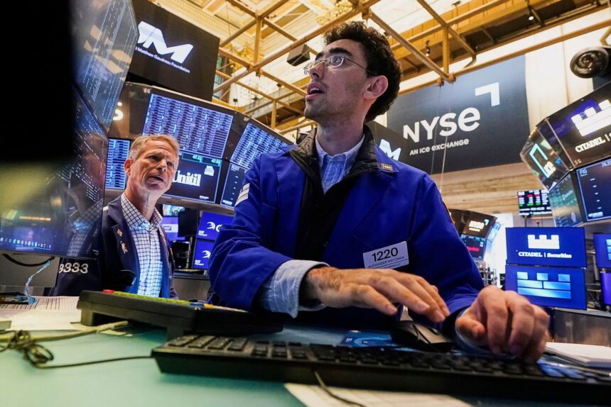 Dow soars more than 800 points into record territory as Powell hints at rate cut