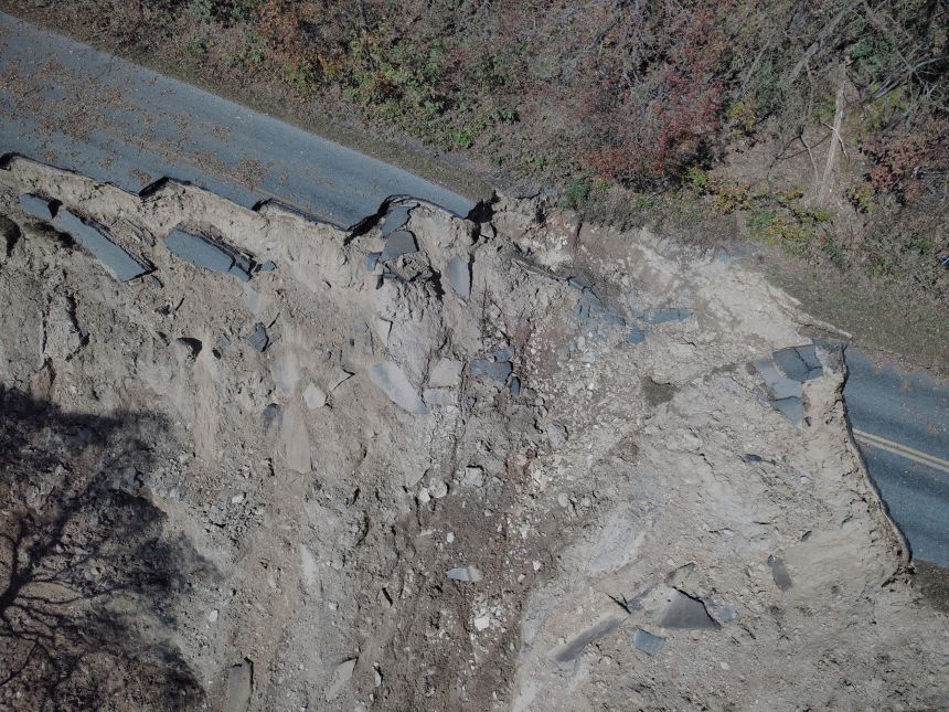 A large crater is left in the motor road where Hurricane Helene washed out the road and slope at milepost 336. October 8, 2024