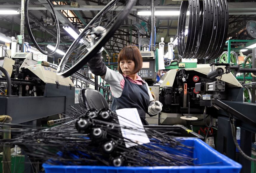 A worker checking e-bike parts at the factory of Giant, the world's biggest bicycle manufacturer, in Taichung, Taiwan, on May 21, 2029.