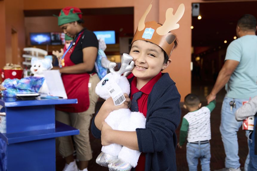 Children build their very own plush inspired by Build-A-Bear's Glisten and the Merry Mission movie at the Howard Hughes Cinemark on November 4, 2023 in Los Angeles.
