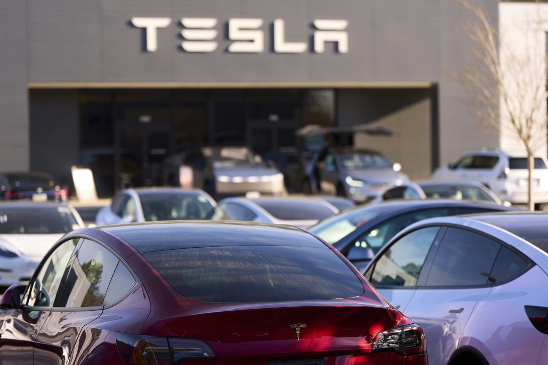 A Tesla model Y and other Telsla vehicles sit at a dealership in Georgia, in March.