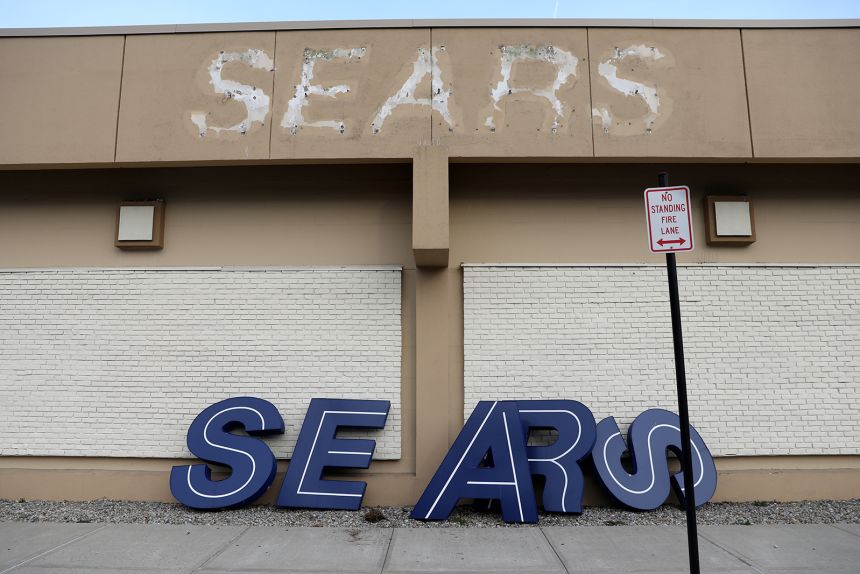 A dismantled sign leans outside a Sears store in Nanuet, New York, one day after it closed in 2019.