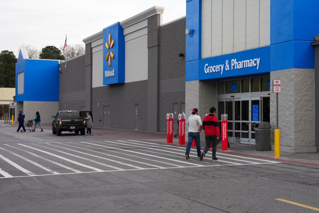 Shoppers walk outside of the Walmart store in Kennesaw, Georgia, where Mahendra “Mick” Patel was shopping in March of this year.