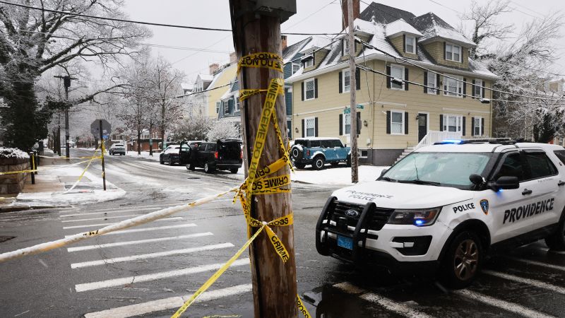 Live updates: Person of interest in custody in Brown University shooting after CNN witnesses police activity at hotel