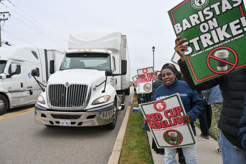 Starbucks Workers United baristas and supporters rally for a union contract outside Starbucks' East Coast distribution center on November 19, 2025, in York, Pennsylvania.