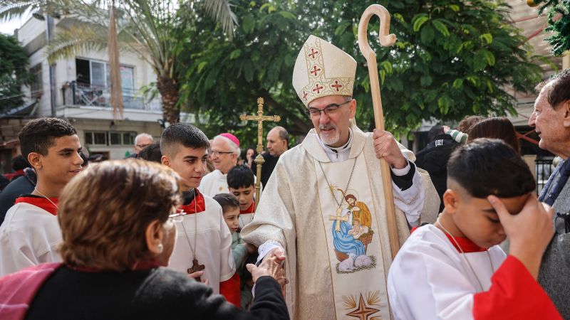 ‘We are still here.’ Catholic patriarch leads Christmas Mass at Gaza church bombed by Israel during the war