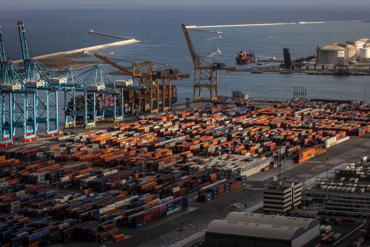 Angel Garcia/Bloomberg/Getty Images via CNN NewsourcePictured are stacked shipping containers in the commercial port of Barcelona on July 7
