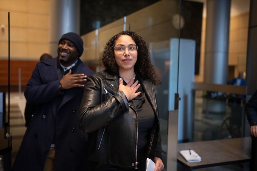 Journalist Georgia Fort was greeted by family and supporters as she left the Federal Courthouse in Minneapolis on Friday after being arrested in connection with a Jan. 18 protest inside a church.