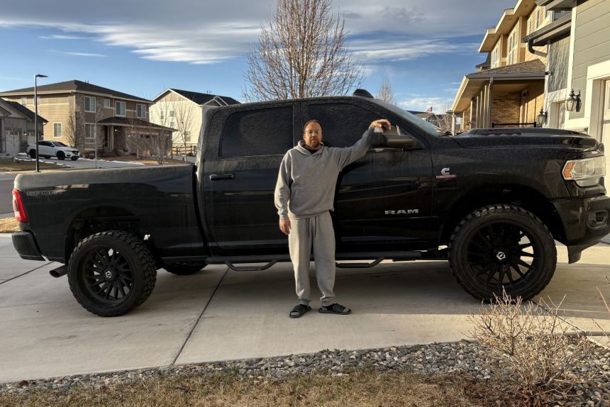 Ravi Stephens II with his Ram 2500 pickup, which he bought with a 84-month loan and payments of more than $1,000 a month.