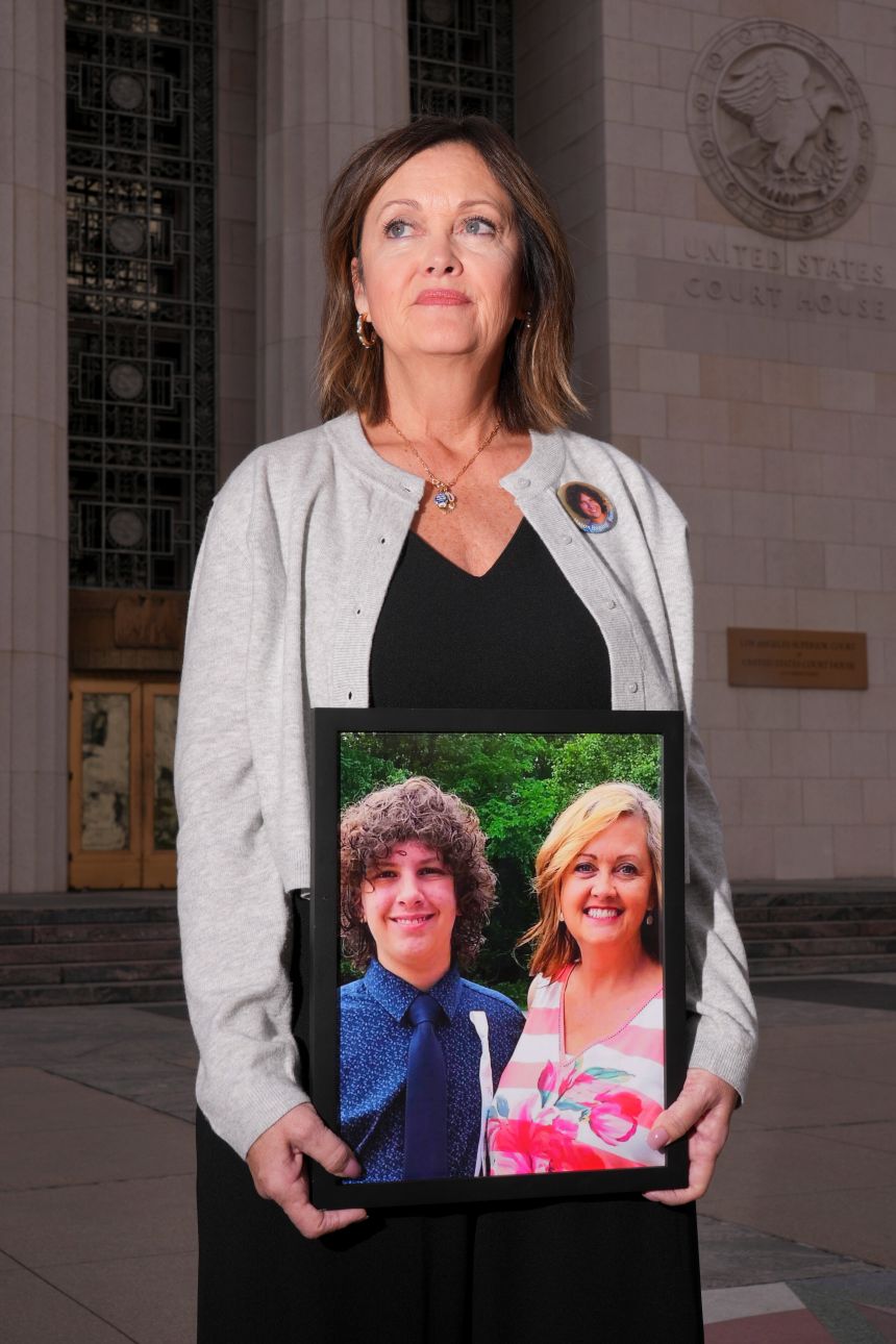 Joann Bogard of Indiana, stands in a vigil for children who died after experiencing social media harms outside the Los Angeles Superior Courthouse earlier this month. Her son Mason died at 15 after trying an online video challenge.