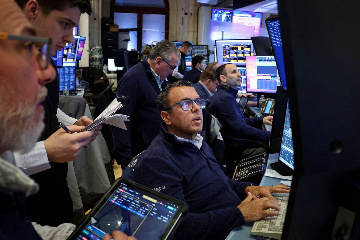 <i>Brendan McDermid/Reuters via CNN Newsource</i><br/>Traders work on the floor at the New York Stock Exchange on Monday
