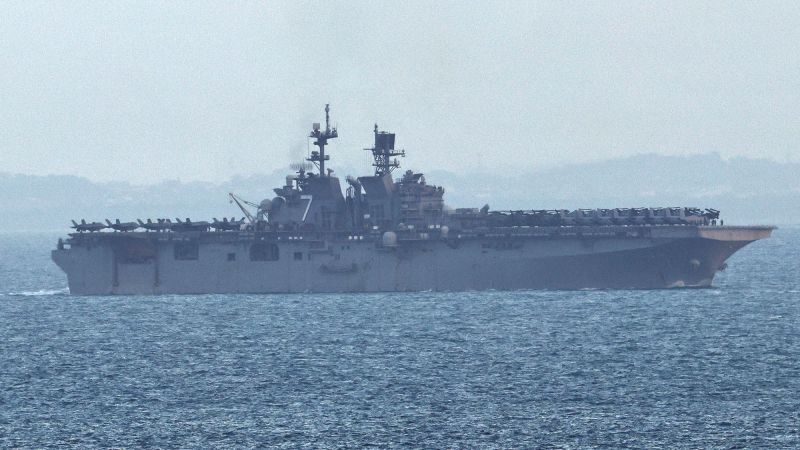 USS Tripoli believed to be carrying Marine ground troops to Middle East tracked off Singapore