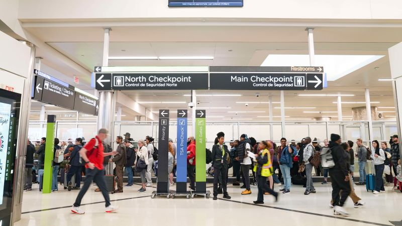 TSA workers face reality of working without pay as passengers unaware of the shutdown see long lines