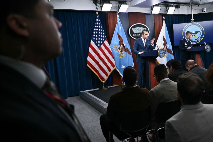 US Defense Secretary Pete Hegseth and the Chairman of the Joint Chiefs of Staff General Dan Caine speak during a press conference on US military action in Iran.