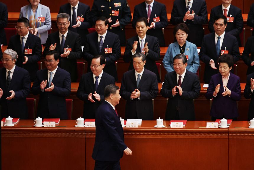 Chinese President Xi Jinping arrives during the closing session of the National People's Congress (NPC), the country's rubber-stamp legislature, at the Great Hall of the People in Beijing on March 12, 2026.