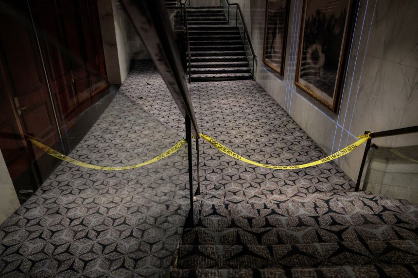 Police cordon tape blocks off an area leading to the ballroom at the Washington Hilton hotel.