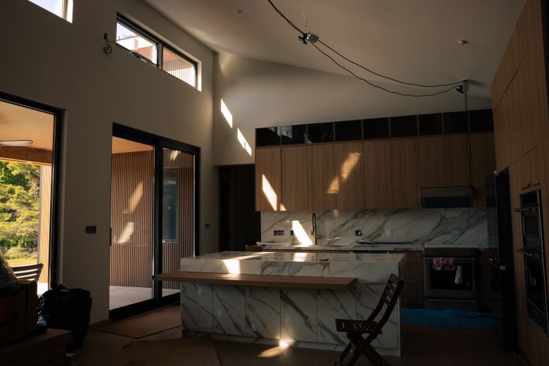 Double-paned and triple-paned glass windows bring light into Tsygan’s  home on April 21, 2026. Almost all the materials seen are from China.