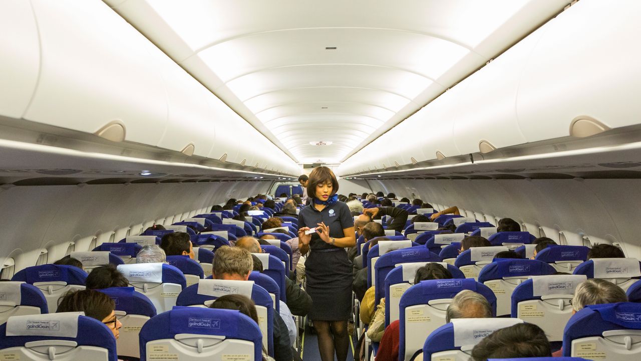 Why Do Flight Attendants Sit on Their Hands?