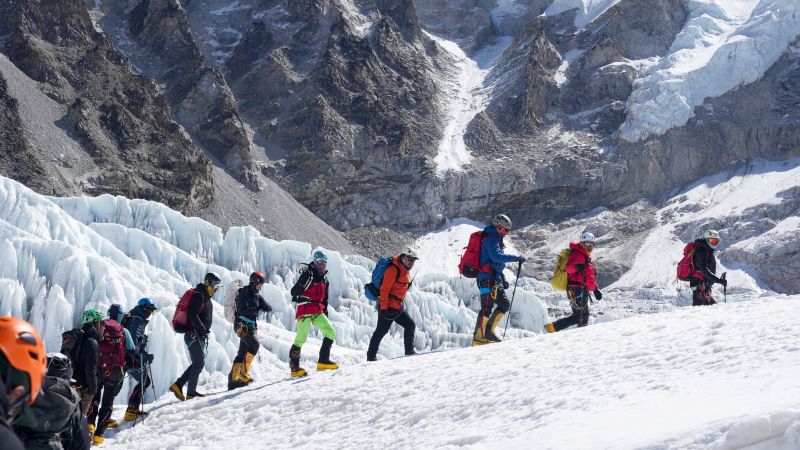 Hundreds of Everest hopefuls are waiting at base camp as glacier blocks route to summit