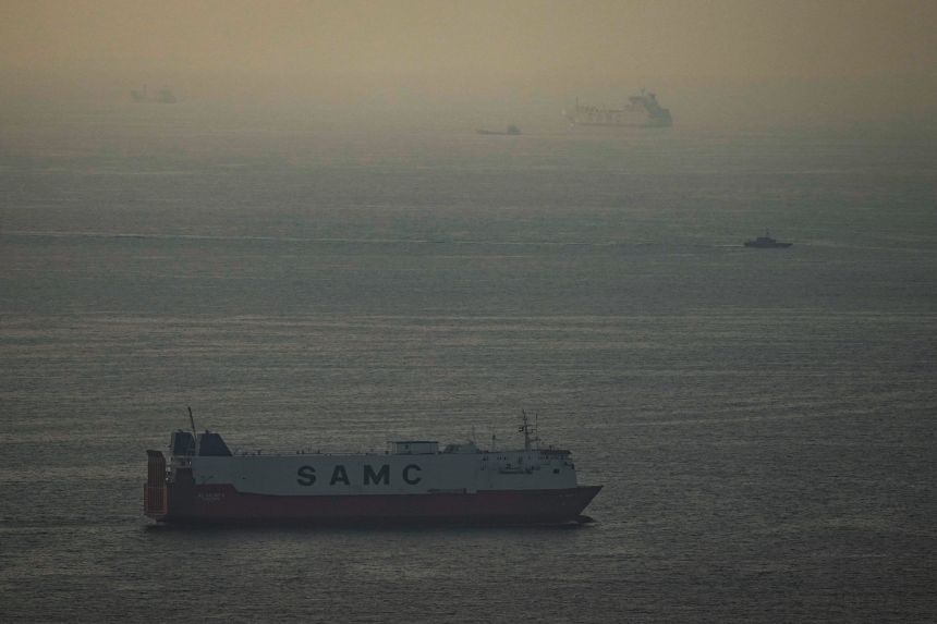 Cargo ships sail in the Arabian Gulf towards Strait of Hormuz in United Arab Emirates, on March 19.