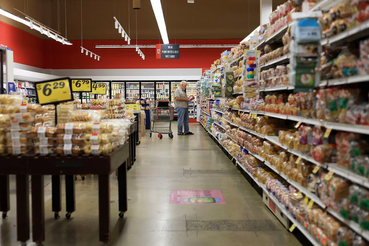 Joe Raedle/Getty Images via CNN NewsourceA customer shops in a grocery store on March 11 in Miami.