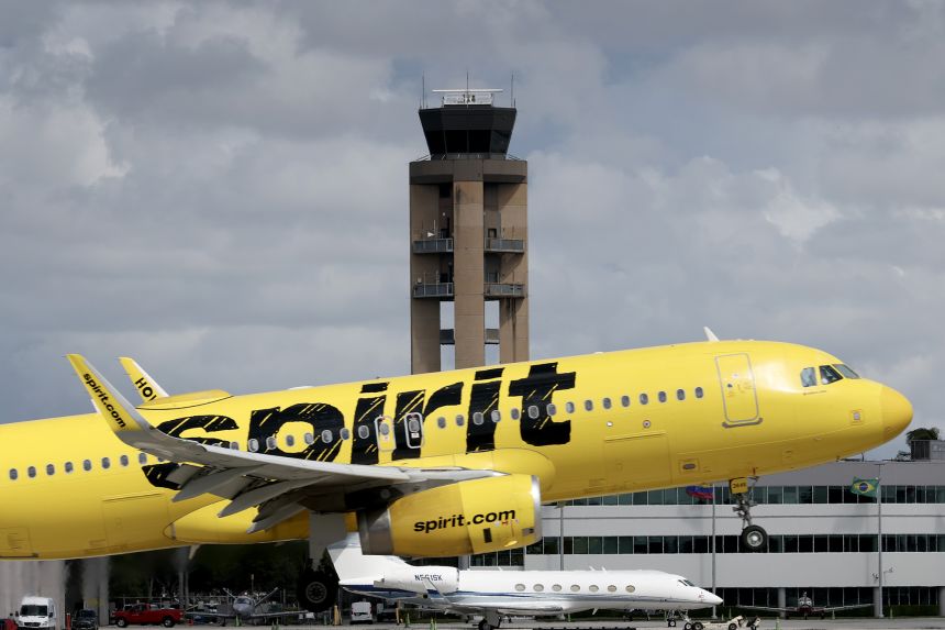 A Spirit Airlines plane lands at the Fort Lauderdale-Hollywood International Airport. Airlines work on very thin profit margins, especially for those following Spirit’s business model.