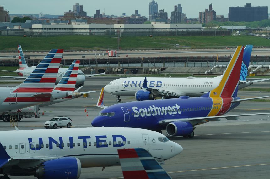 Planes of United Airlines, Southwest Airlines and American Airlines are seen at LaGuardia Airport in New York on April 23, 2026.