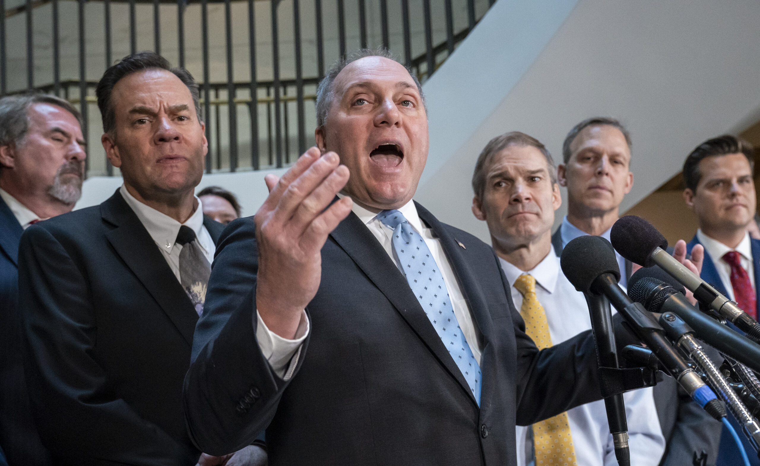 House Minority Whip Steve Scalise, R-La., flanked by Rep. Russ Fulcher, R-Idaho, left, and Rep. Jim Jordan, R-Ohio, right, the ranking member of the Committee on Oversight Reform, and other conservative House Republicans, complain to reporters about how House Intelligence Committee Chairman Adam Schiff, D-Calif., is conducting the impeachment investigation of President Donald Trump, at the Capitol in Washington, Wednesday, Oct. 23, 2019. House committees are trying to determine if Trump violated his oath of office by asking a foreign country, Ukraine, to investigate his political opponent, former Vice President Joe Biden, and his son Hunter Biden. (AP Photo/J. Scott Applewhite)
