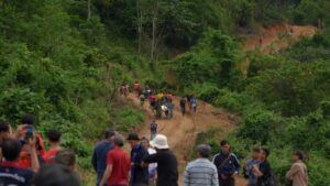 NCS on scene as rescued laos villagers load ambulance