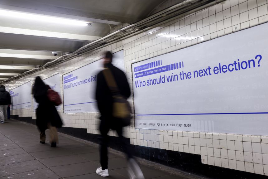 A Polymarket advertisement asking who should win the next election in a subway station in New York. The prediction market platform recently became available to American users.