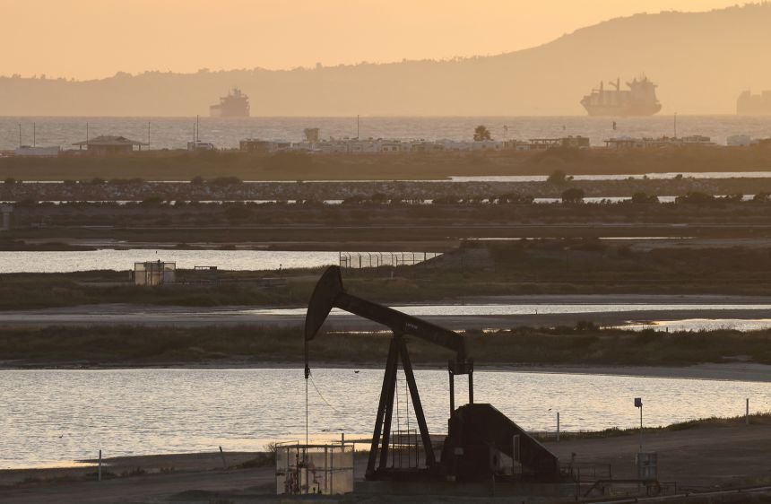 A pumpjack stands idle in the Huntington Beach oil field on April 23, in Huntington Beach, California. Investing in commodities can serve as a hedge against inflation.