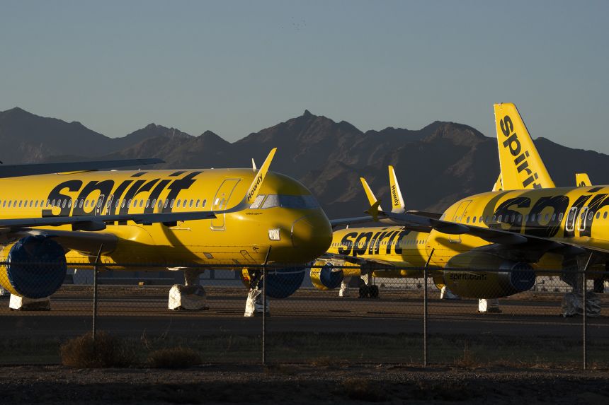 Spirit Airlines planes sit parked at the Phoenix Goodyear Airport on May 8, days after the airline ceased all flights due to financial problems.
