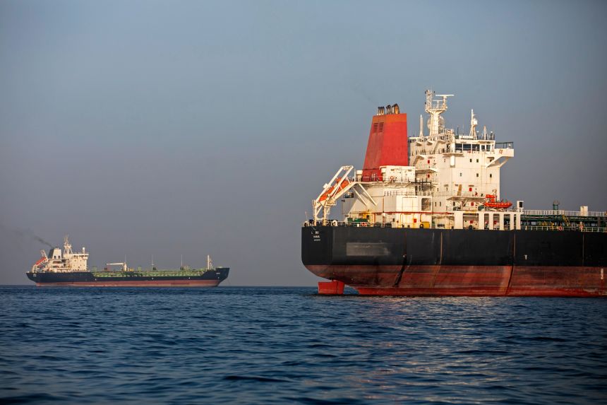 Ships remain anchored on May 16, in the Strait of Hormuz near Larak Island, Iran.