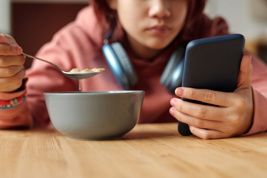 Parents are on devices during meals even more than their kids. Here’s how to rethink family dinner