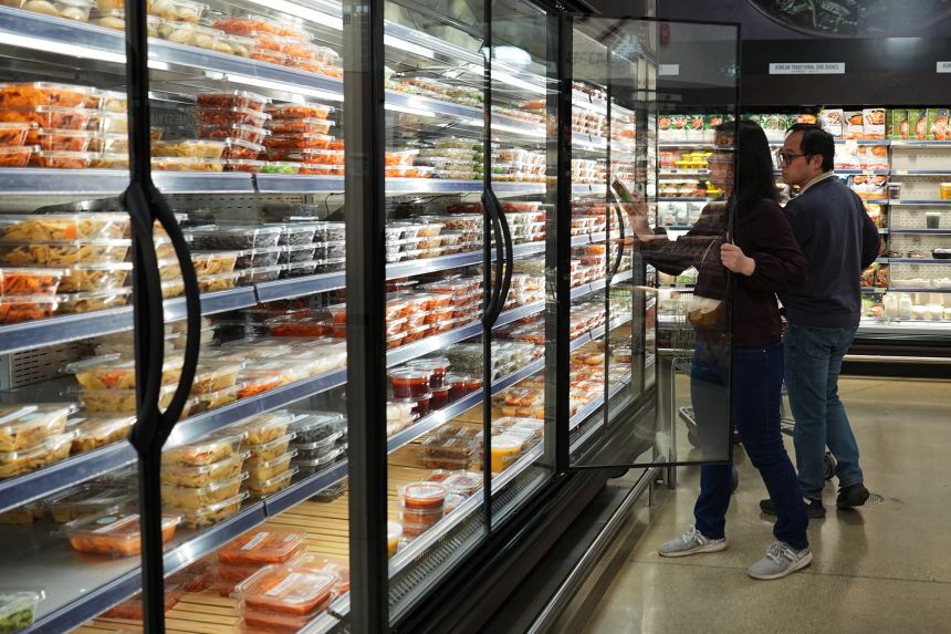 People shop at a grocery store in Schaumburg, Illinois, on May 14, 2026.