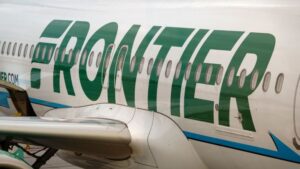 Frontier passenger chokes off-duty flight attendant after trying to open exit door and cockpit on Chicago flight, police say