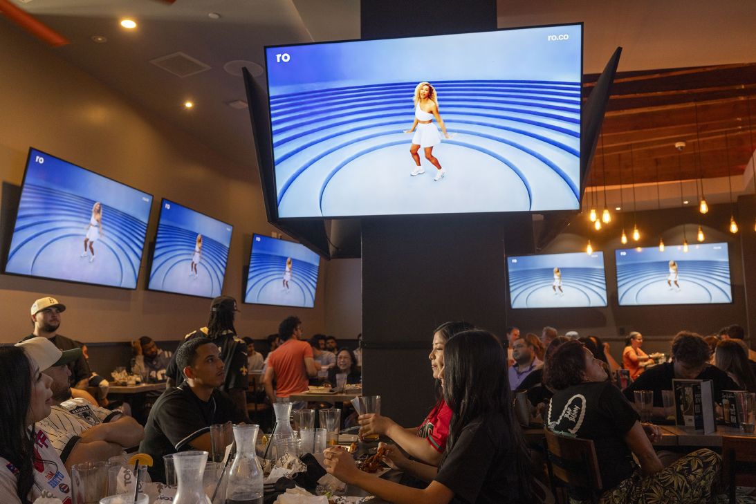 A commercial for GLP-1 drugs during the Super Bowl LX broadcast on television screens at a bar in California, United States in February 2026.